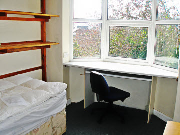 Back bedroom with lovely views to the City and to the Haldon Hills.